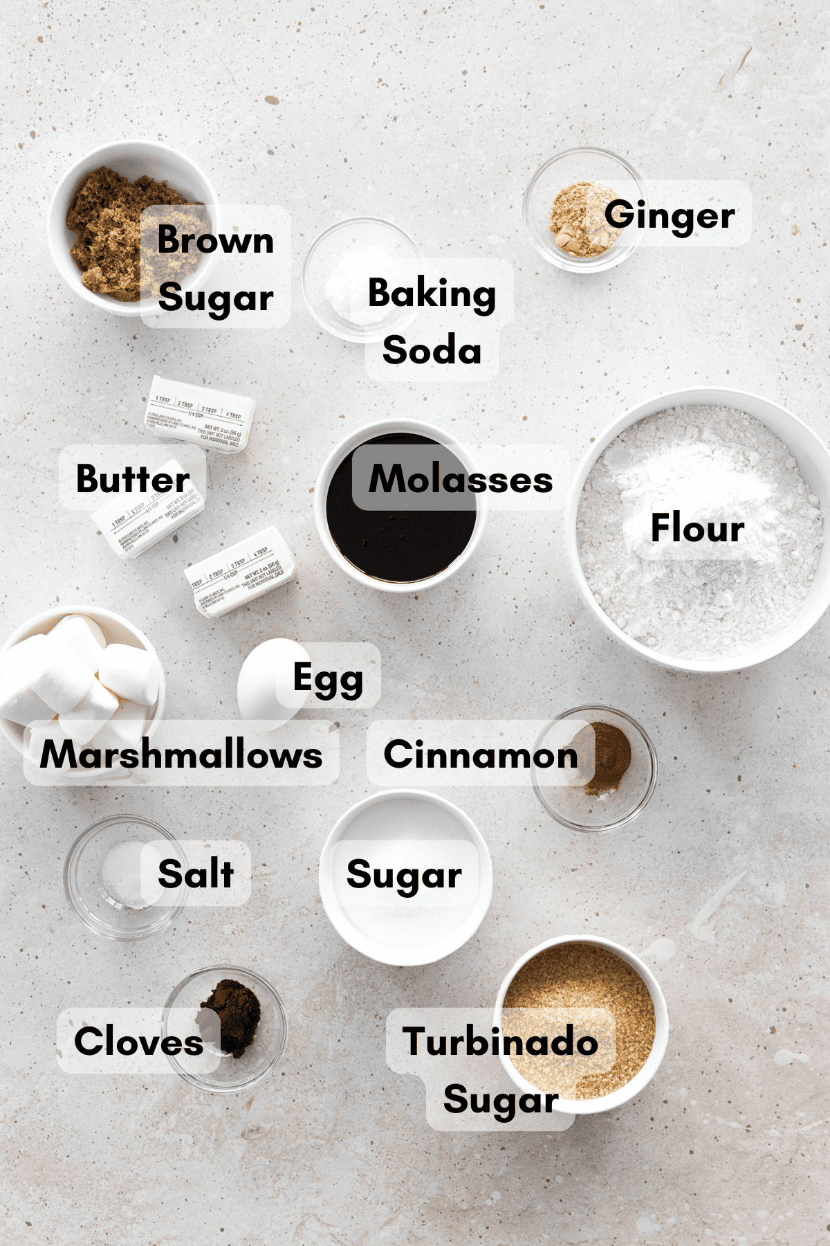 Ingredients for Molasses Marshmallow Stuffed Cookies in small bowls. 
