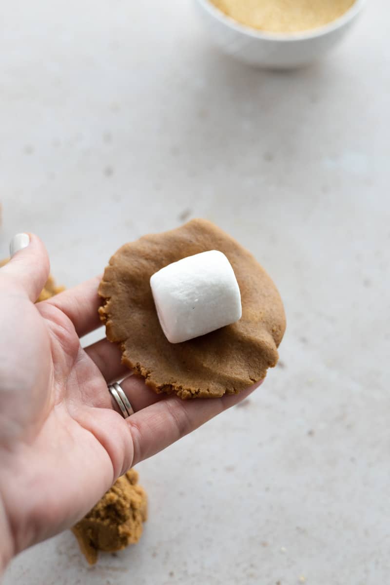 Marshmallow in the center of the dough circle. 