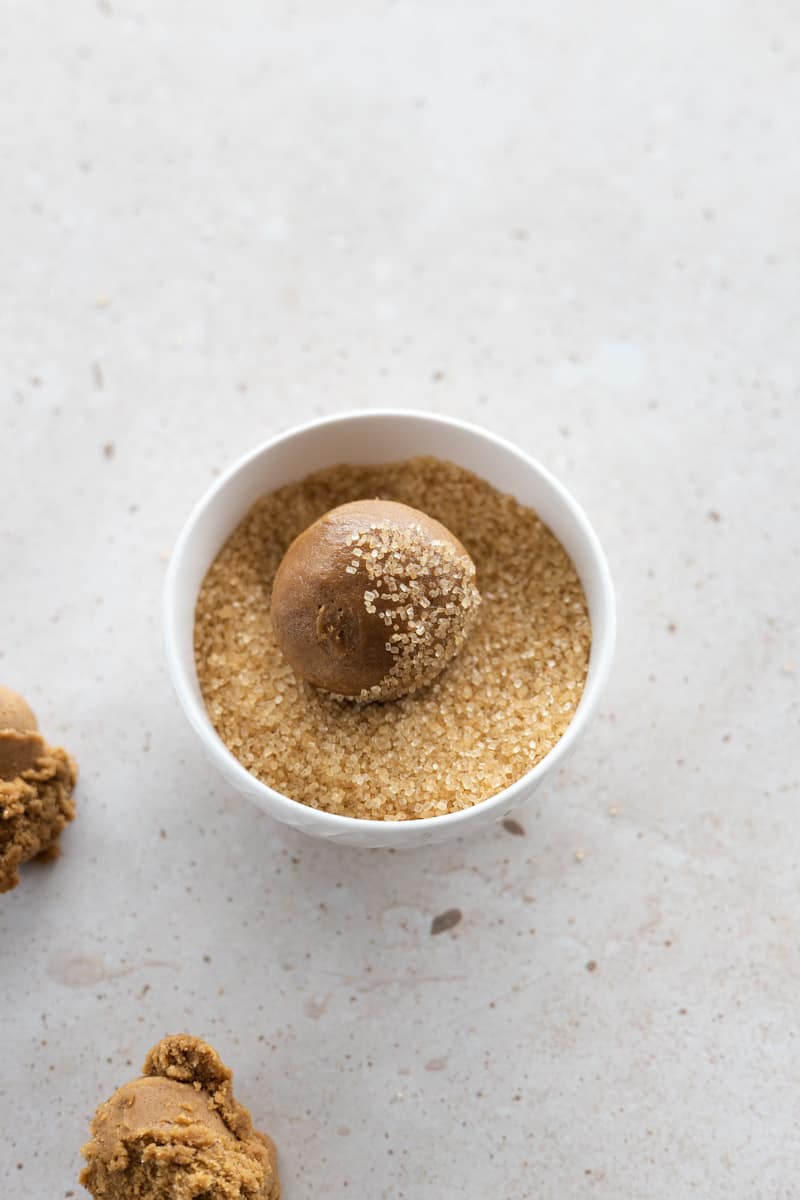 Dough ball in a bowl of turbinado sugar. 