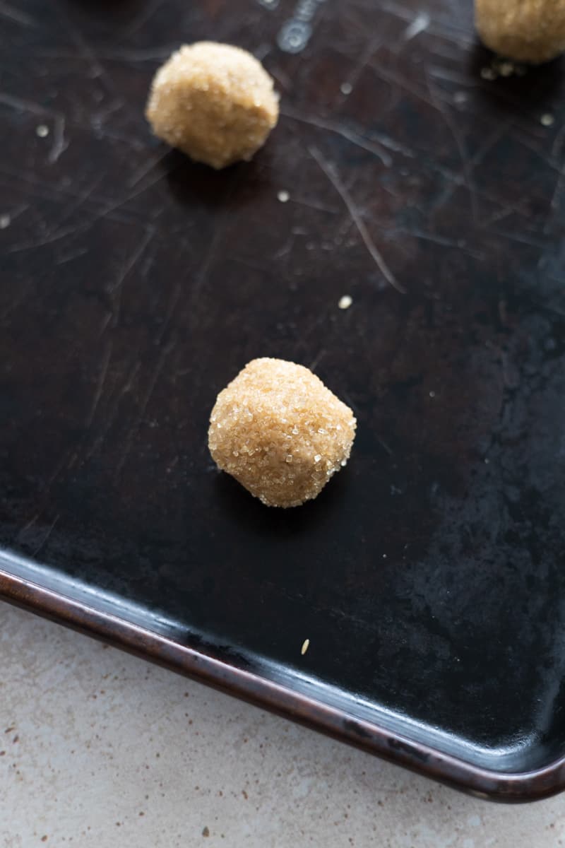 Dough balls ready to bake on a baking sheet. 