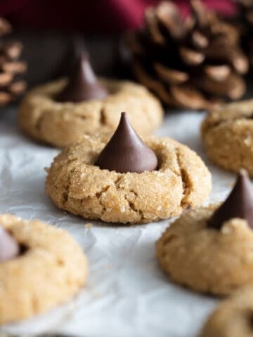 Peanut Kisses on a parchment paper.