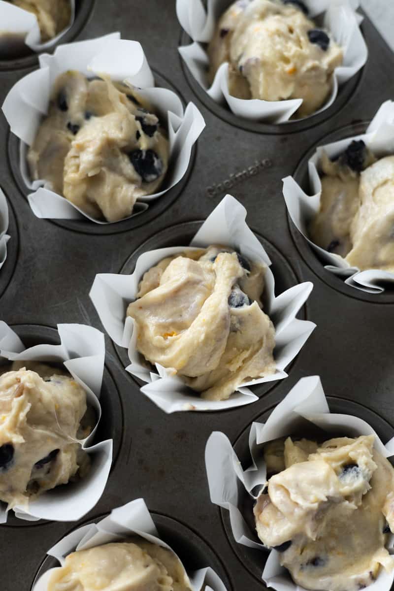 Batter in lined muffin cups. 