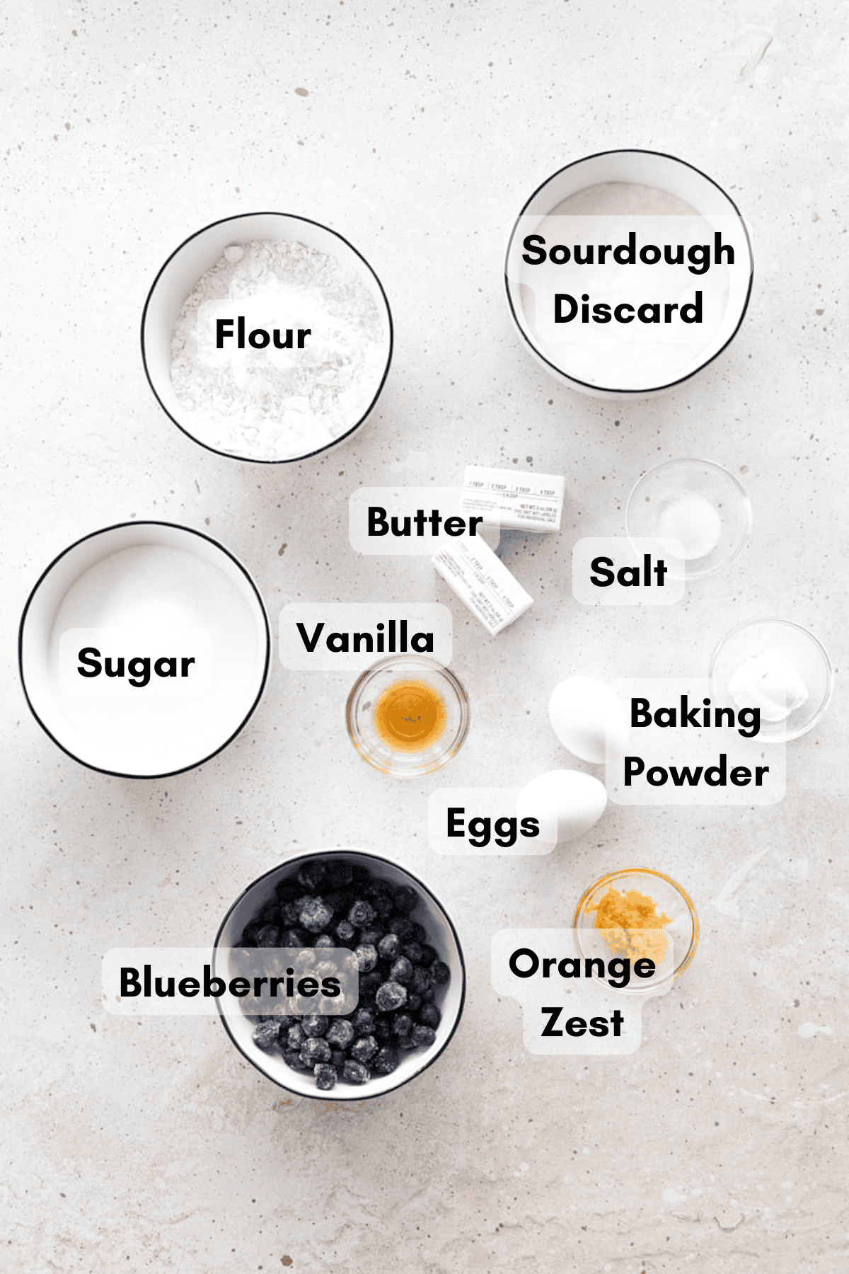 Ingredients for Sourdough Discard Blueberry Muffins in small bowls. 