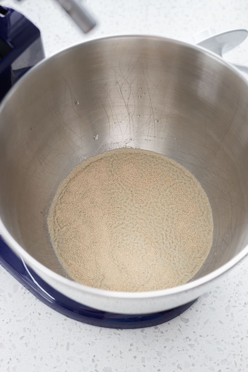 Yeast blooming in the bowl of a stand mixer.