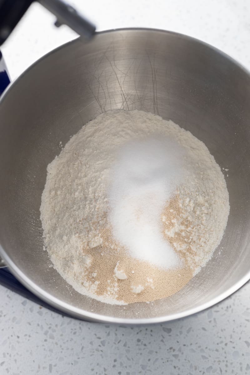 Dry ingredients in the bowl of a stand mixer.