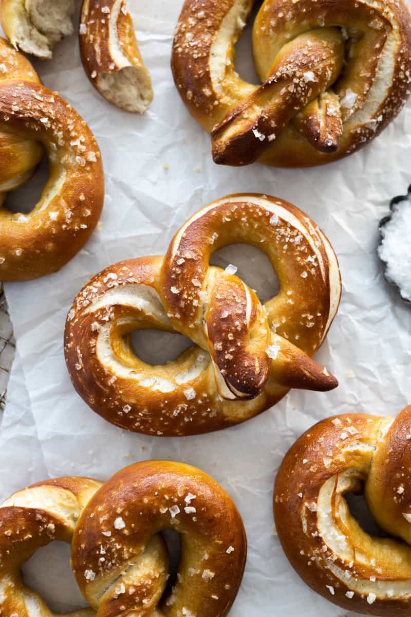 Sourdough discard pretzels on white parchment paper. 