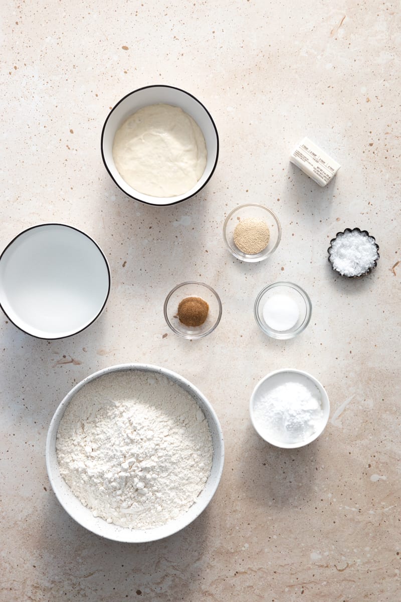 Ingredients for sourdough discard pretzels in small bowls. 