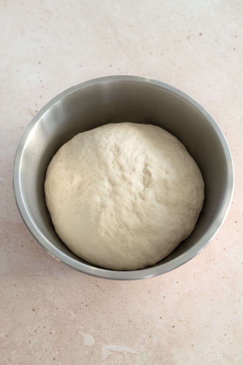 Dough in a large bowl after rising. 