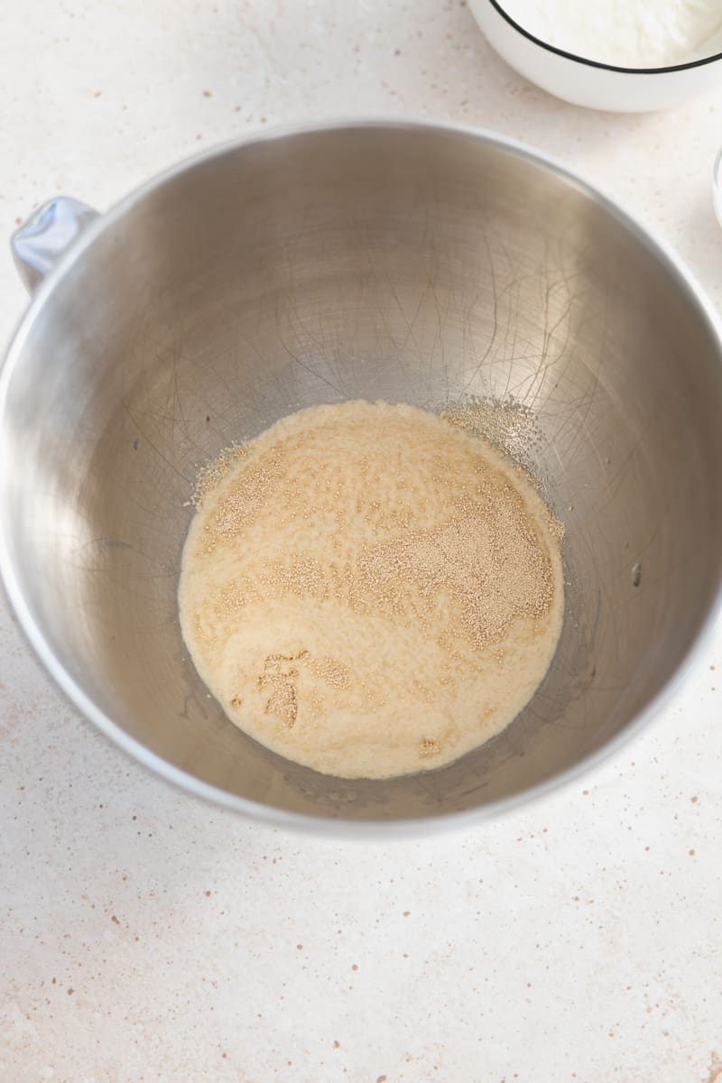 Yeast foaming in the bowl of a stand mixer.