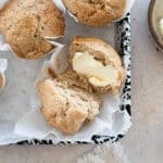 Sourdough Discard Banana Muffins on white parchment paper.