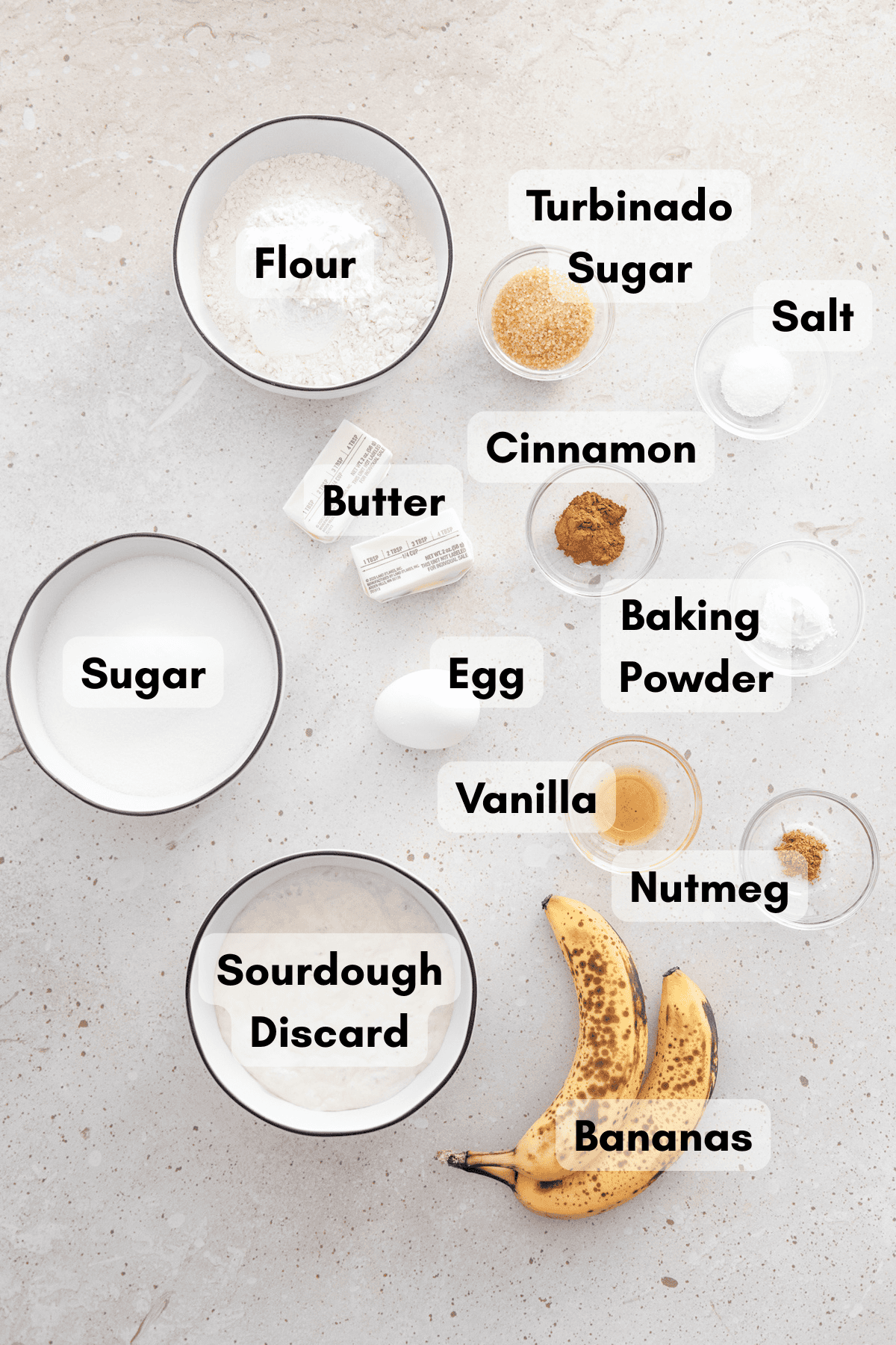 Ingredients for Sourdough Discard Banana Muffins in small bowls.