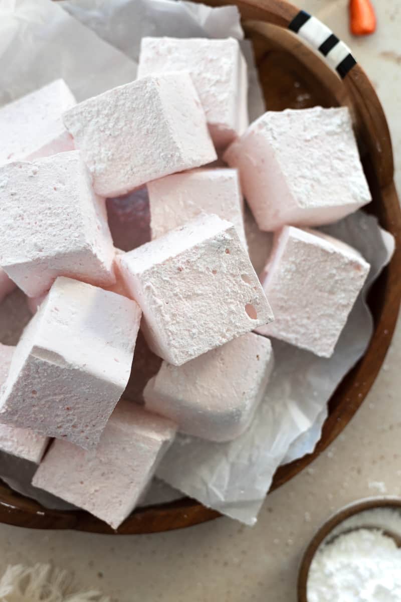 Overhead view of Strawberry Pink Marshmallows on a wooden tray.