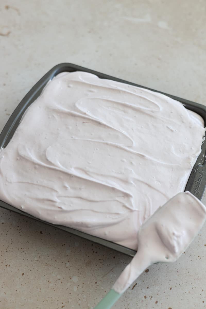 Marshmallow spread in a baking pan.
