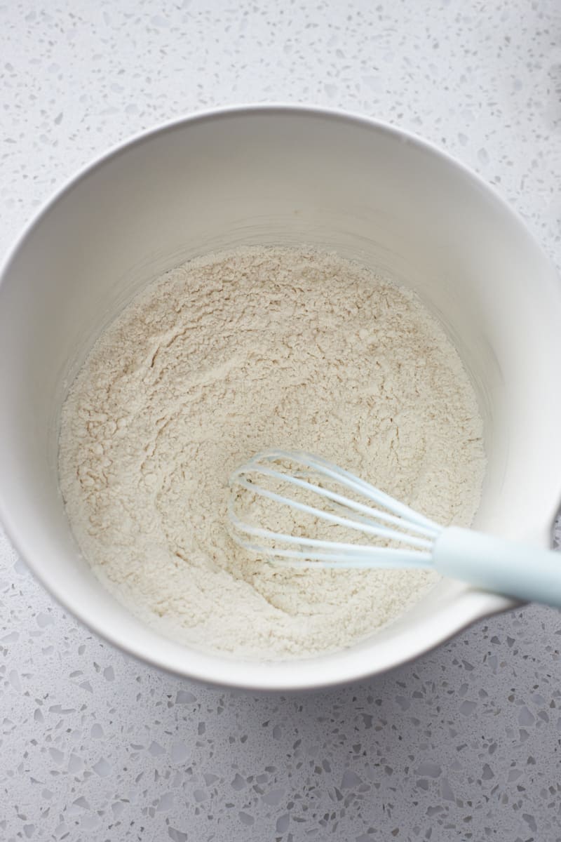 Dry ingredients mixed together in a large white bowl.