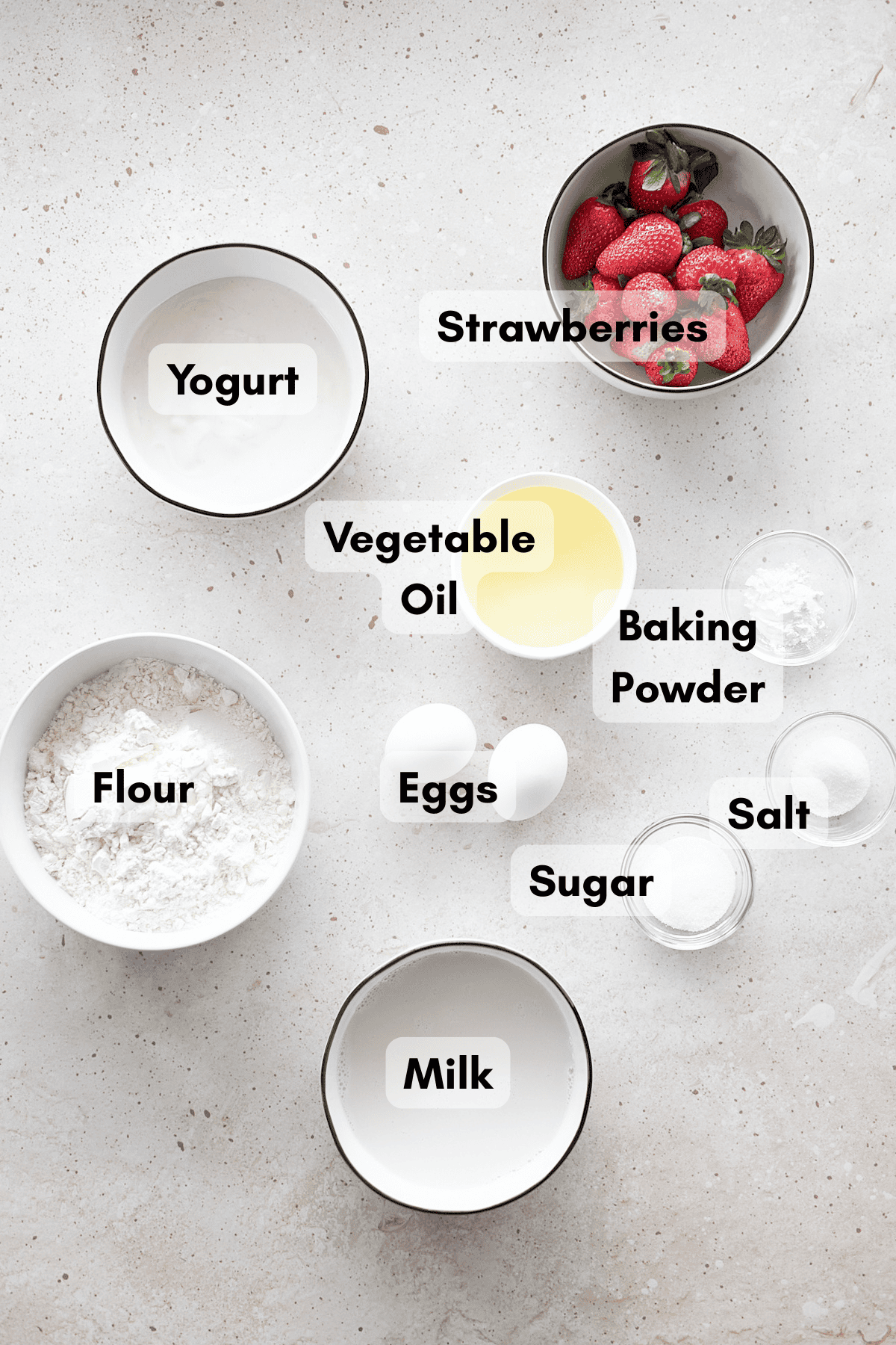 Ingredients for Strawberry Waffles in small bowls.