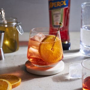 Aperol Soda in a cocktail glass garnished with an orange slice.