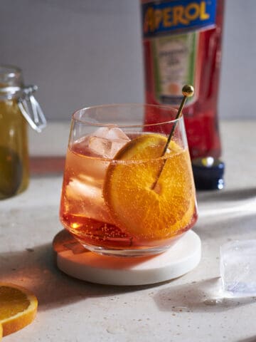 Aperol Soda in a cocktail glass garnished with an orange slice.