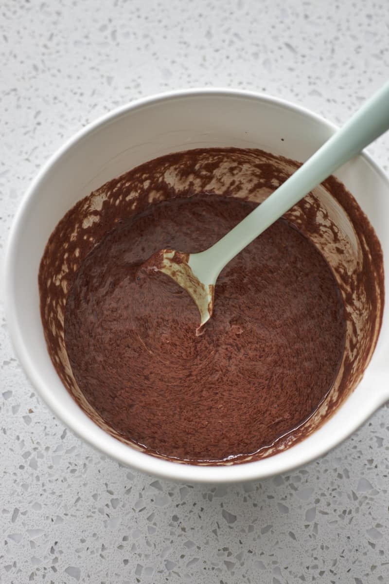 Sourdough discard and the chocolate butter mixture mixed together in a large bowl.