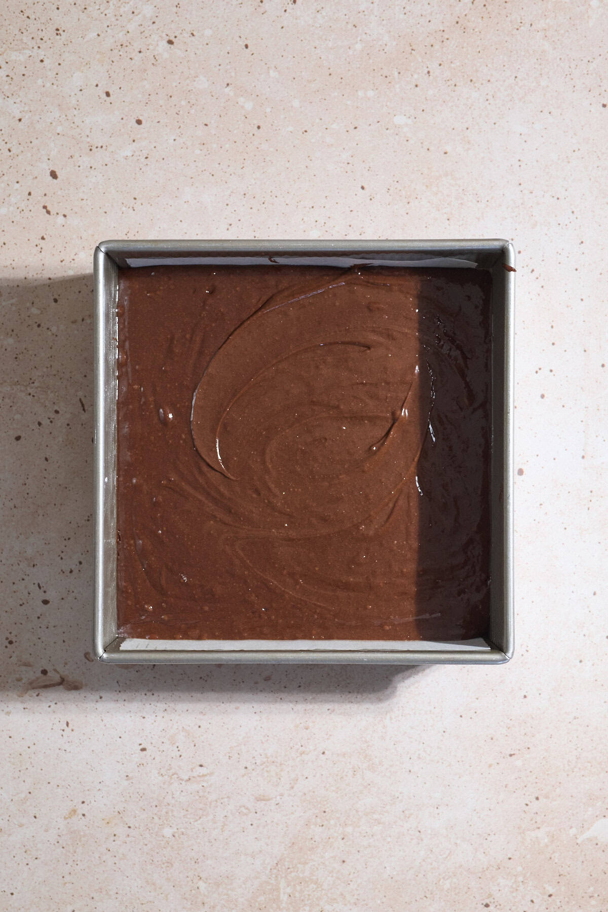 Batter spread into the baking pan.