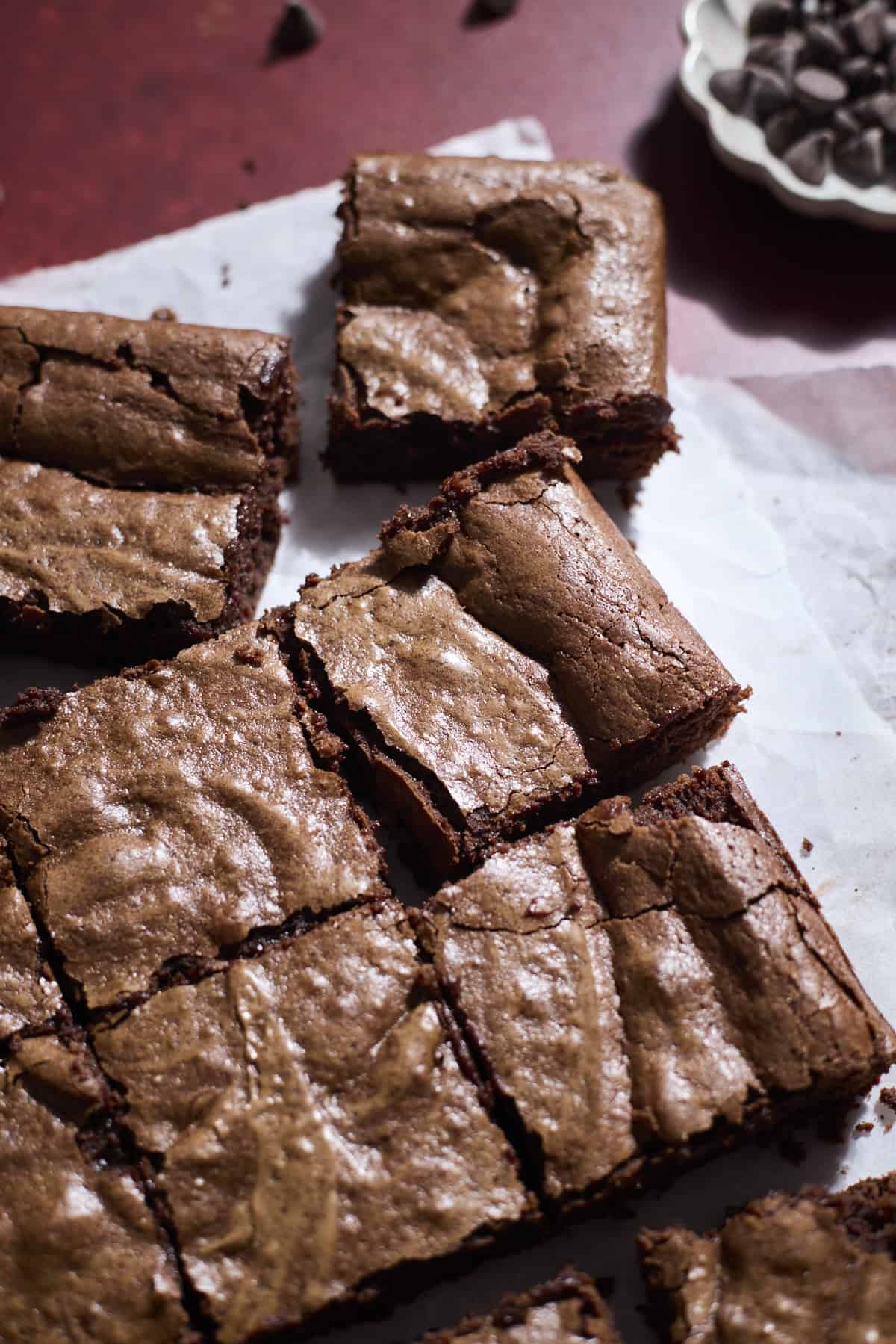 Sourdough Discard Brownies on white parchment paper. 