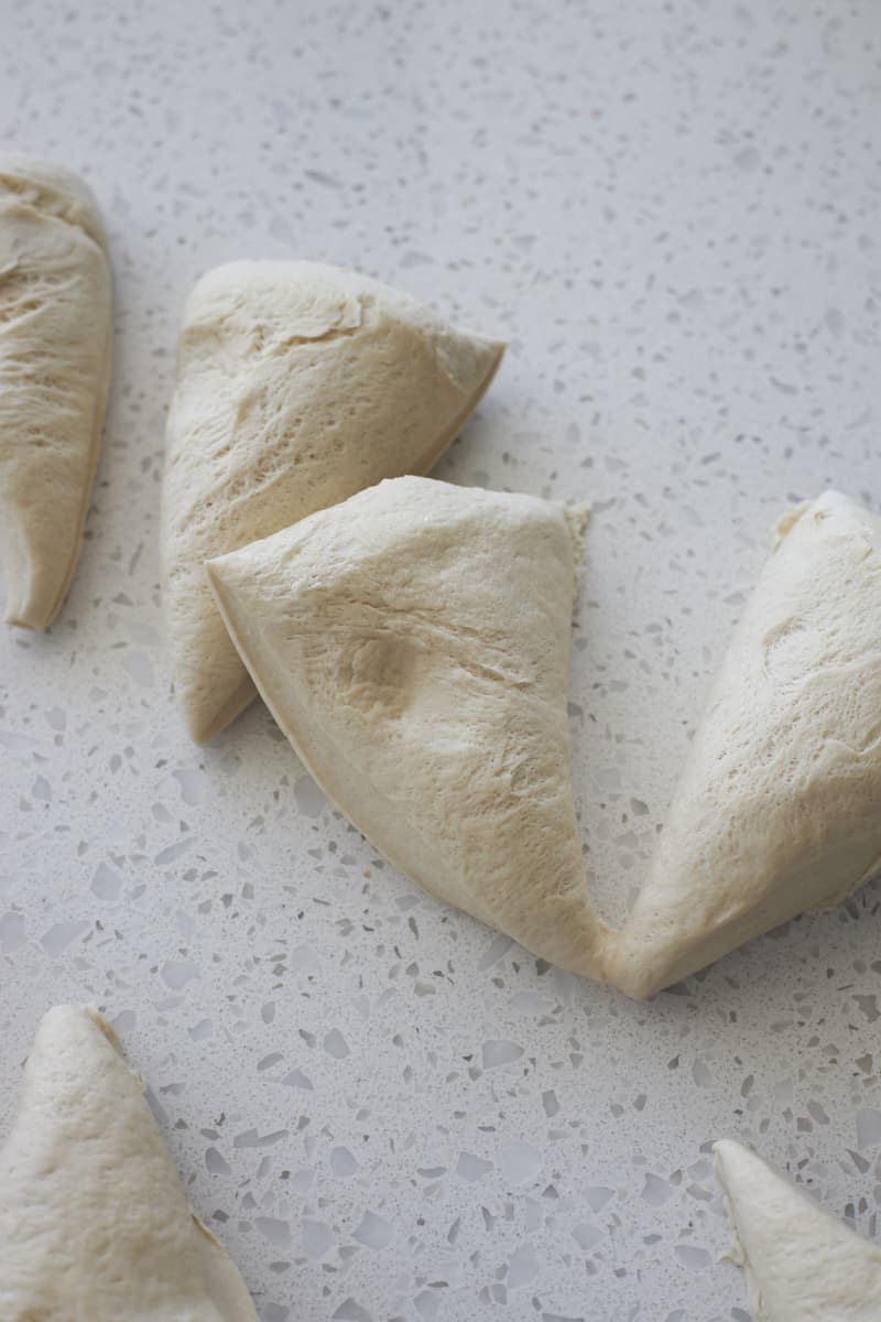 Dough divided into 8 triangle pieces.
