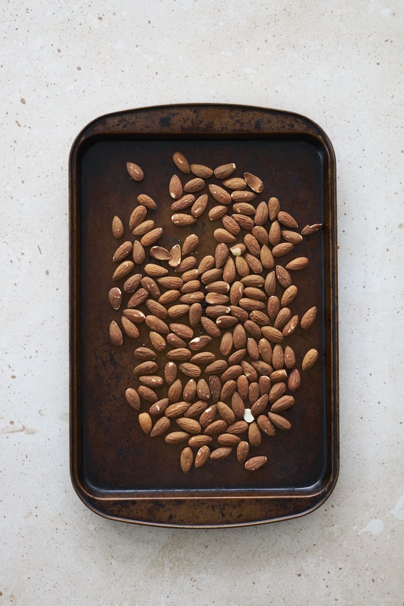 Almonds on a small baking sheet.