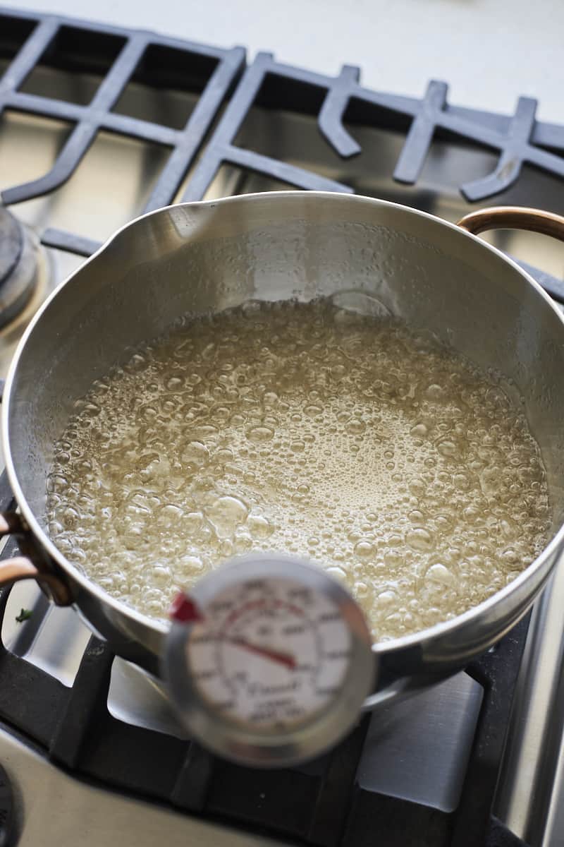 Sugar mixture boiling in a saucepan.