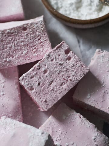 A sideview of two Blackberry Marshmallows.