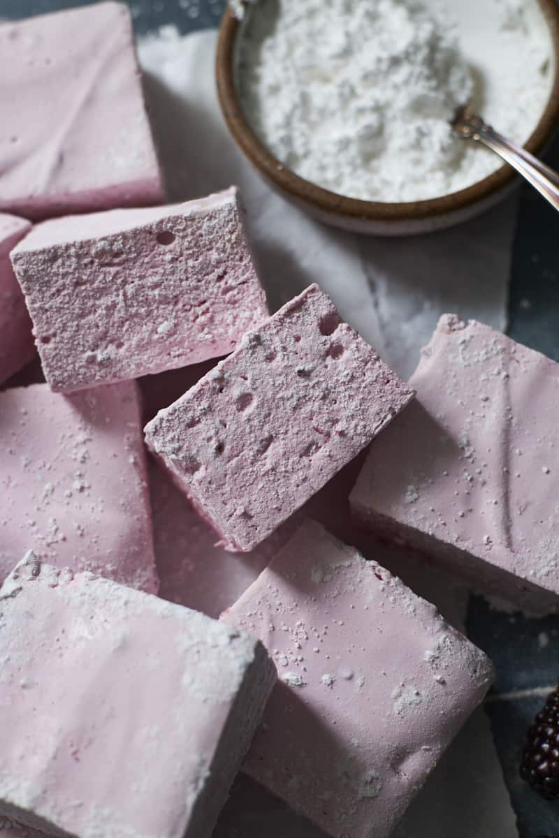 A sideview of two Blackberry Marshmallows.