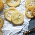 Candied Lemon Slices on white parchment paper.