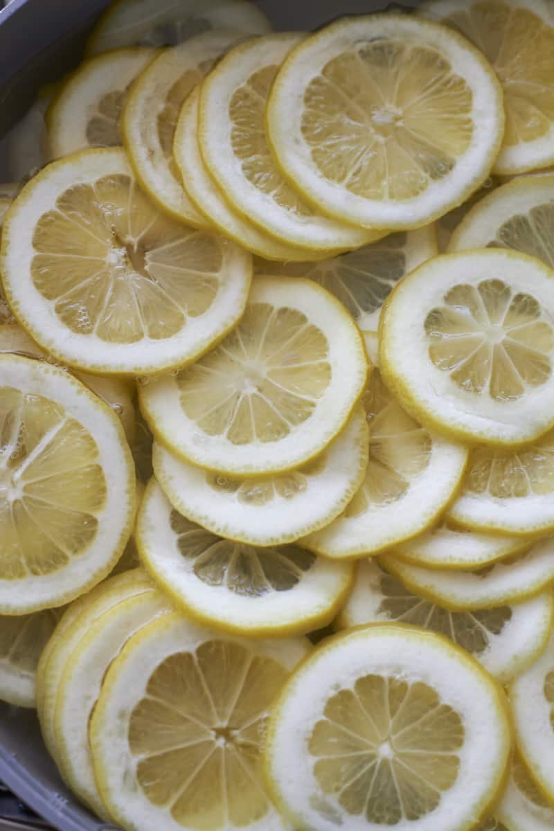 Lemon slices in a pot of water.