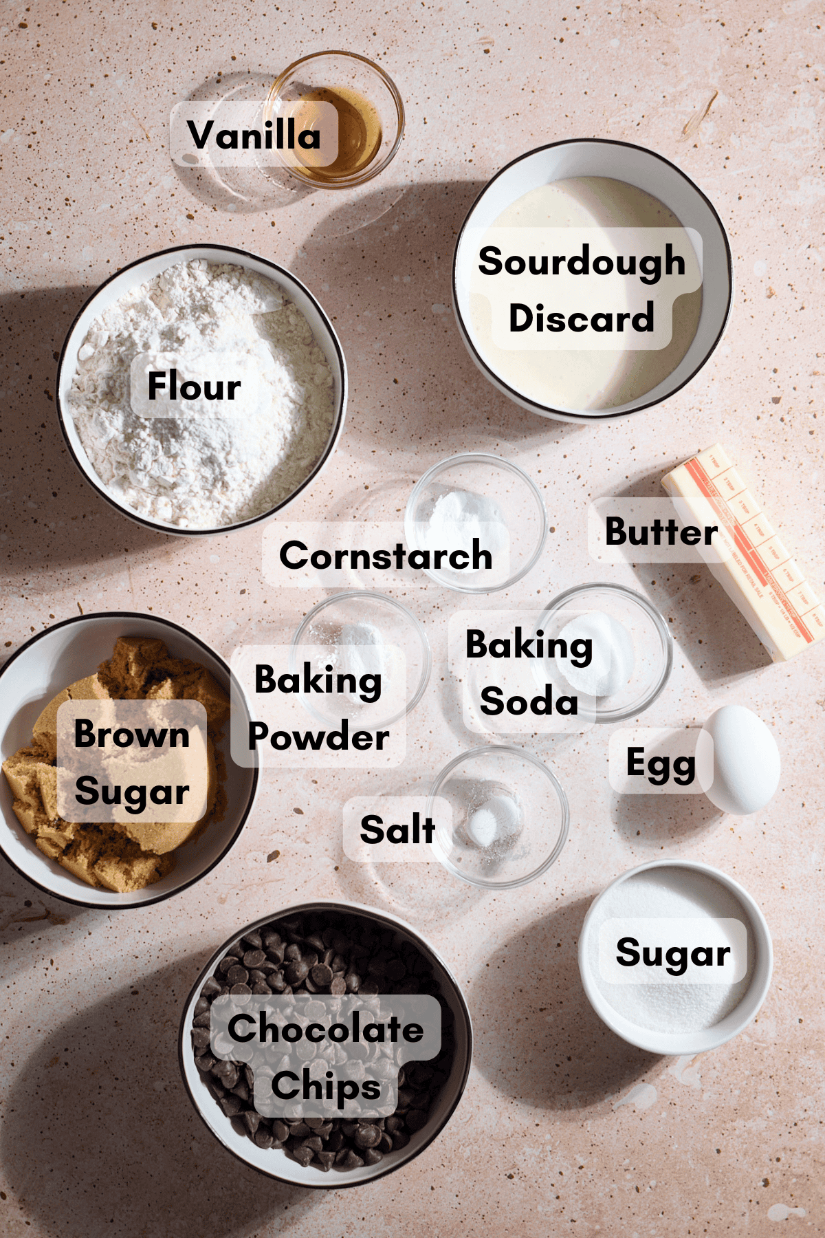 Ingredients for Sourdough Discard Chocolate Chip Cookies in small bowls. 