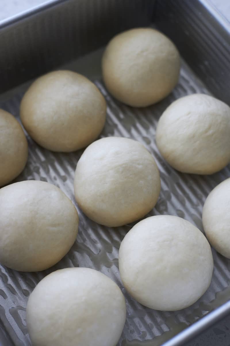 Sourdough Discard Garlic Rolls in a pan before the second rise.