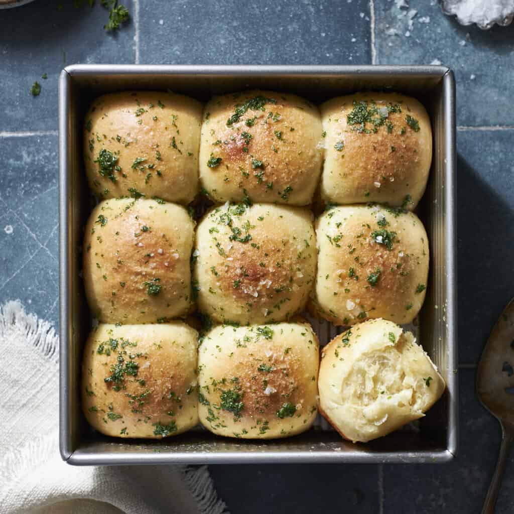 Sourdough Discard Garlic Rolls in a square pan.