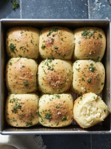 Sourdough Discard Garlic Rolls in a square pan.