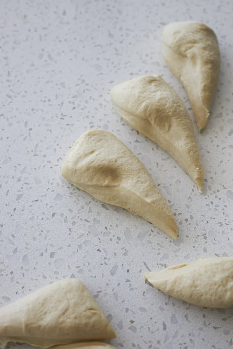 Dough divided into 8 equal-sized pieces.