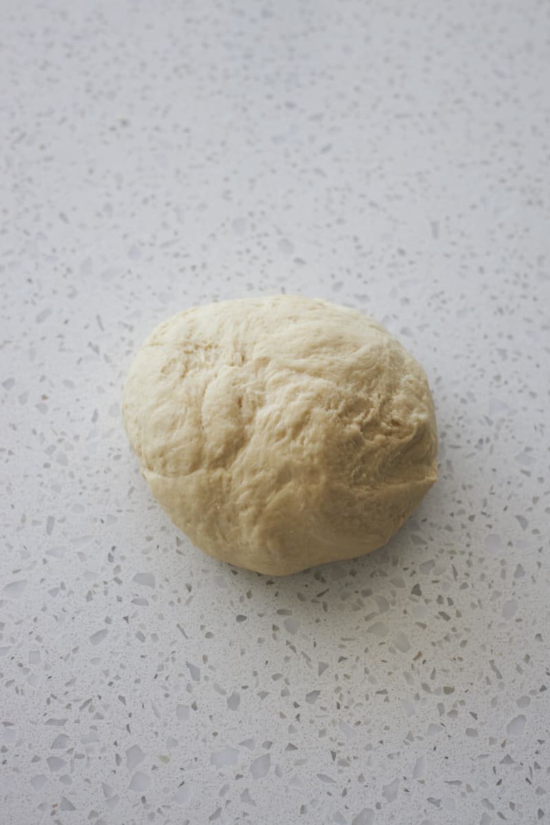 Smooth dough on a work surface.