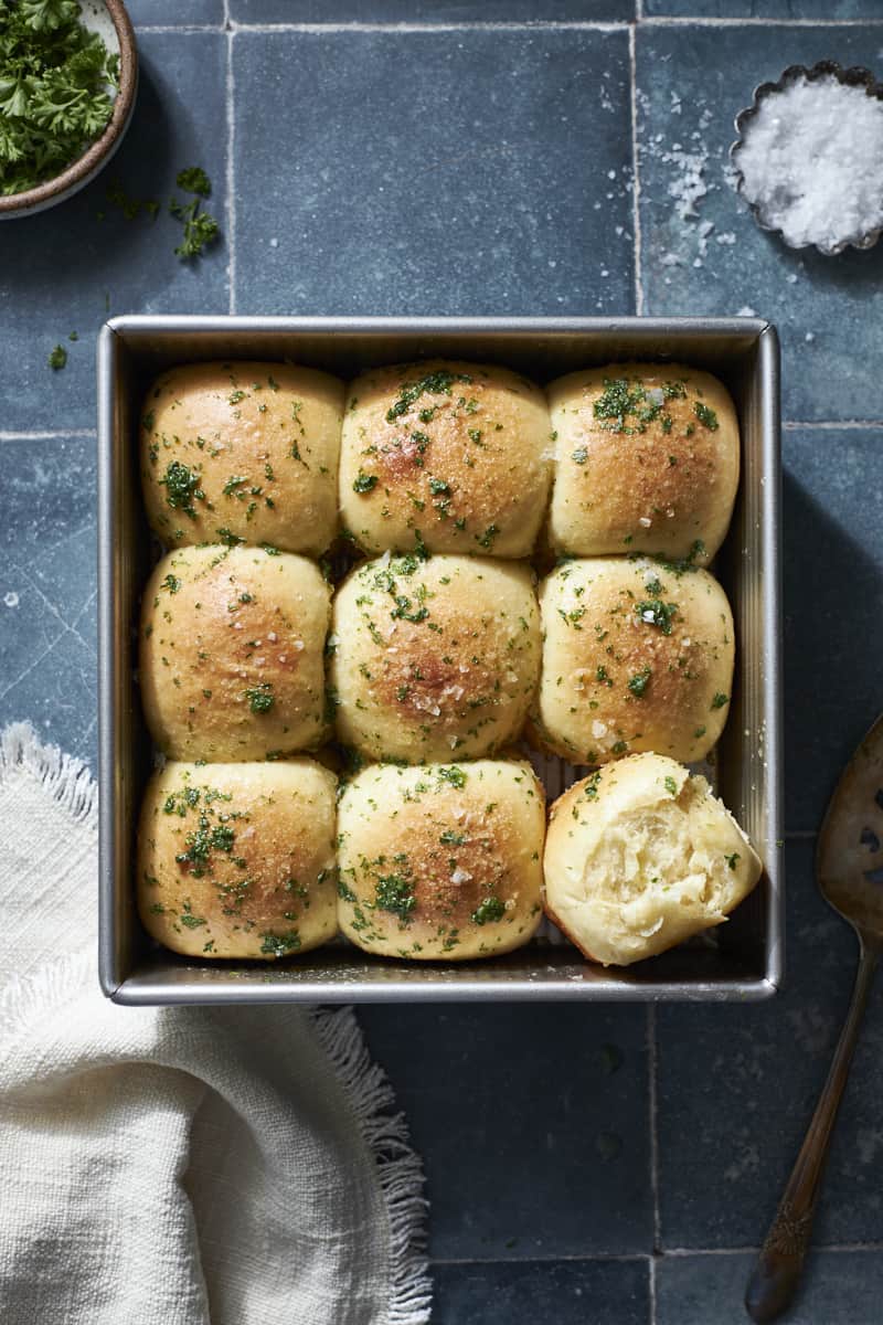 Sourdough Discard Garlic Rolls in a square pan.