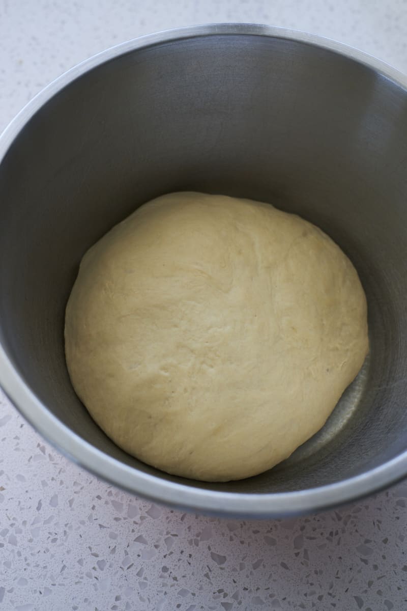 Dough after rising in a large bowl.