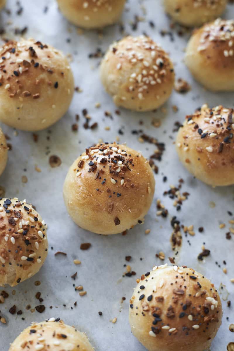 Sourdough discard bagel bites on parchment paper after baking.