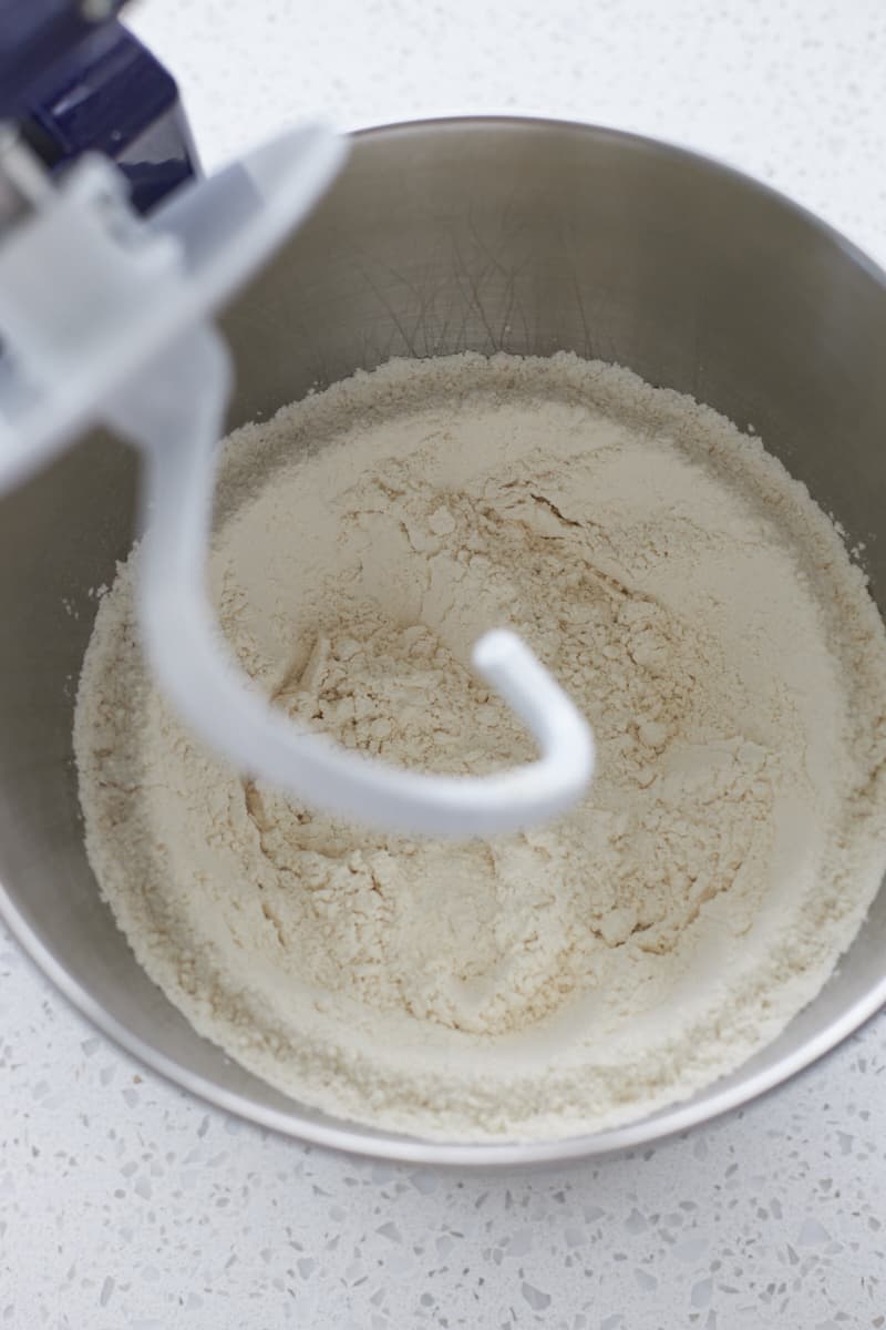 Dry ingredients mixed in the bowl of a stand mixer.