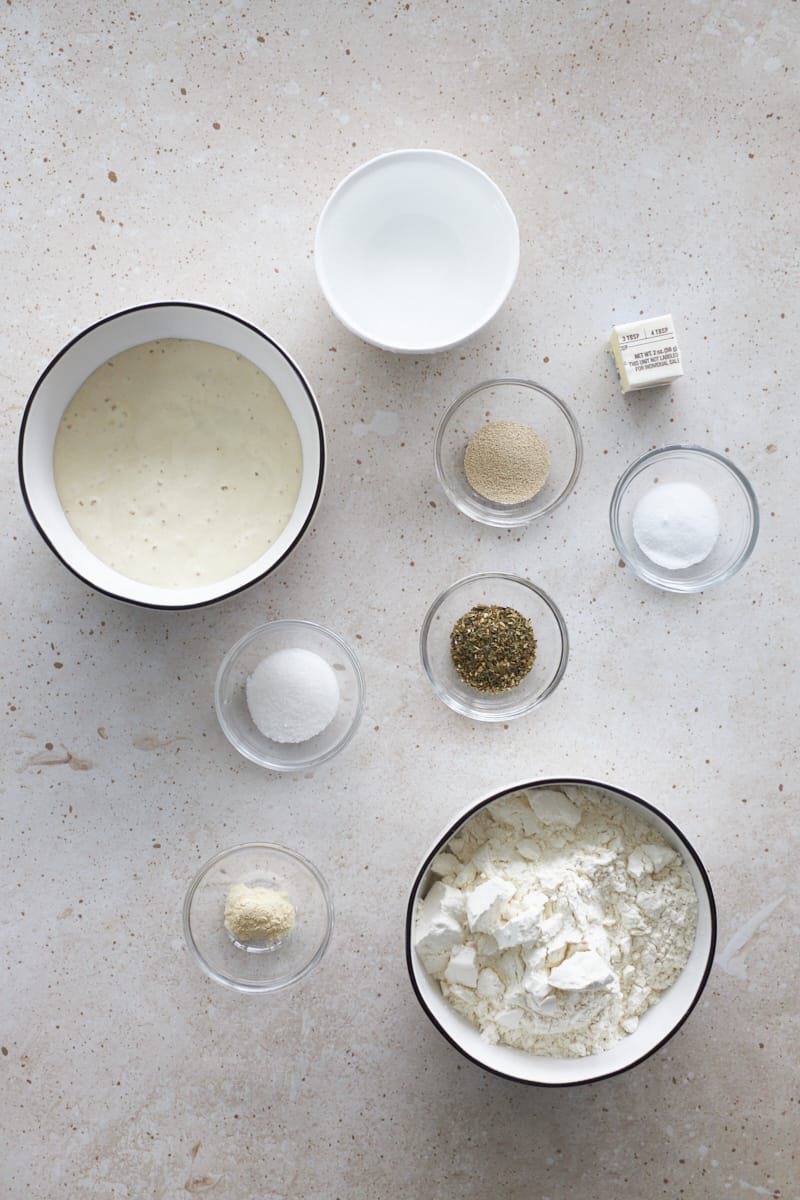 Ingredients for sourdough discard breadsticks in small bowls.