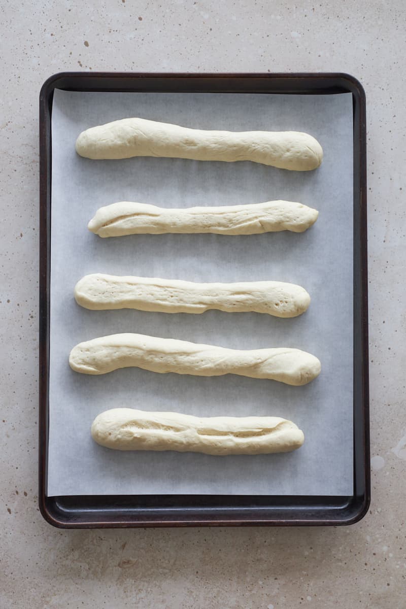 Sourdough discard breadsticks on a baking sheet.