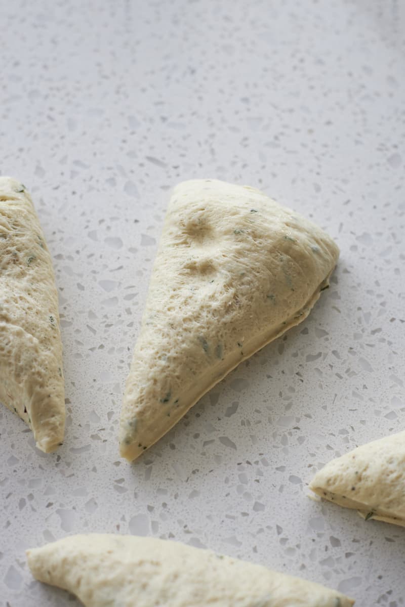 Dough divided into triangle pieces.