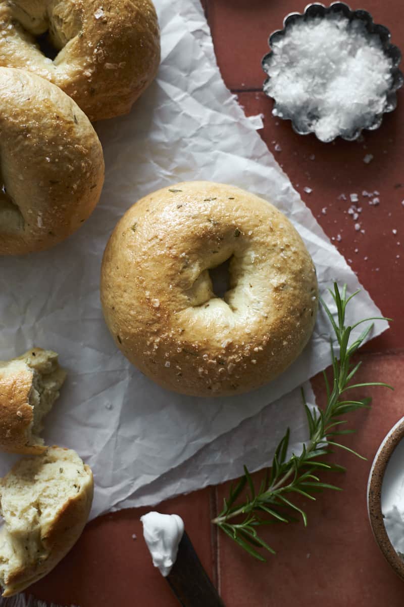 Rosemary Bagels on white parchment paper.