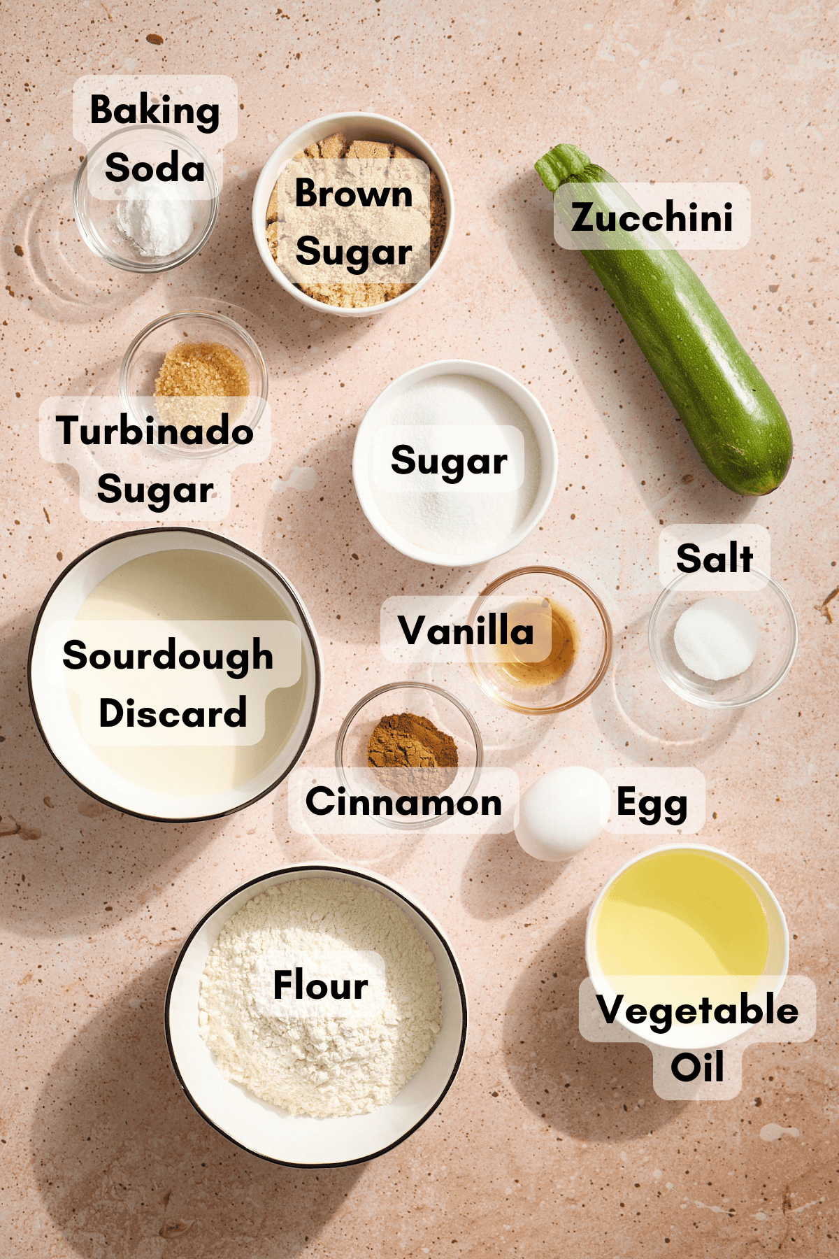 Ingredients for Sourdough Discard Zucchini Bread in small bowls. 