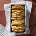 Sourdough Discard Garlic Pull Apart Bread in the bread pan.