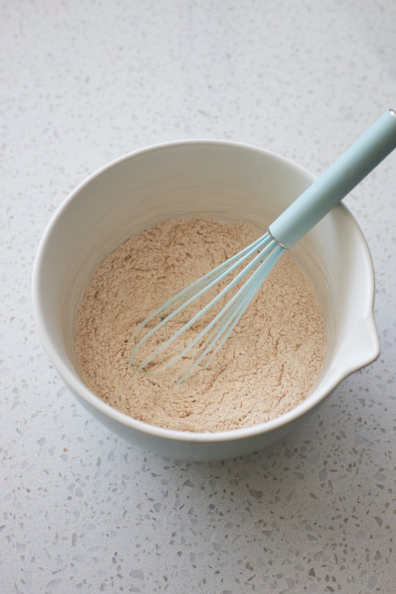 Dry ingredients mixed in a mixing bowl.