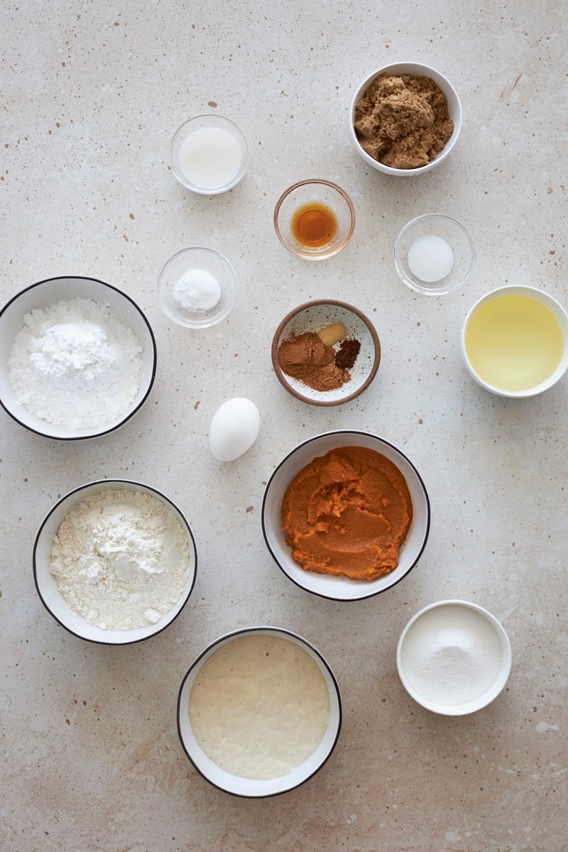 Ingredients for Sourdough Discard Pumpkin Bread in small bowls.