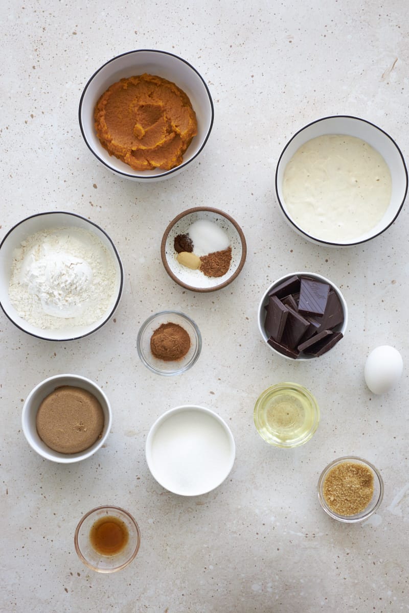 Ingredients for Sourdough Discard Pupmkin Chocolate Chunk Bread in small bowls.